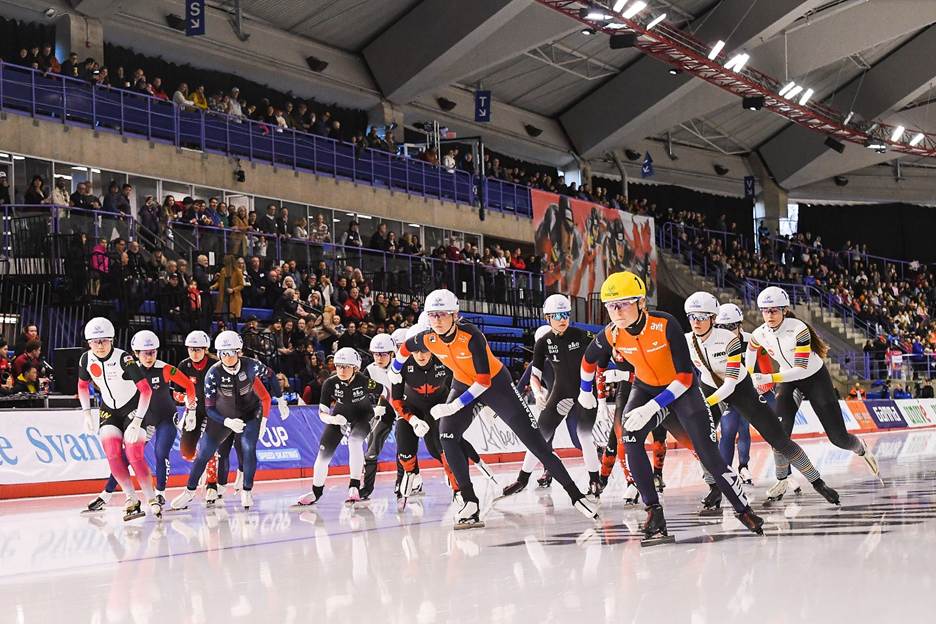 A group of people on ice skatingAI-generated content may be incorrect.