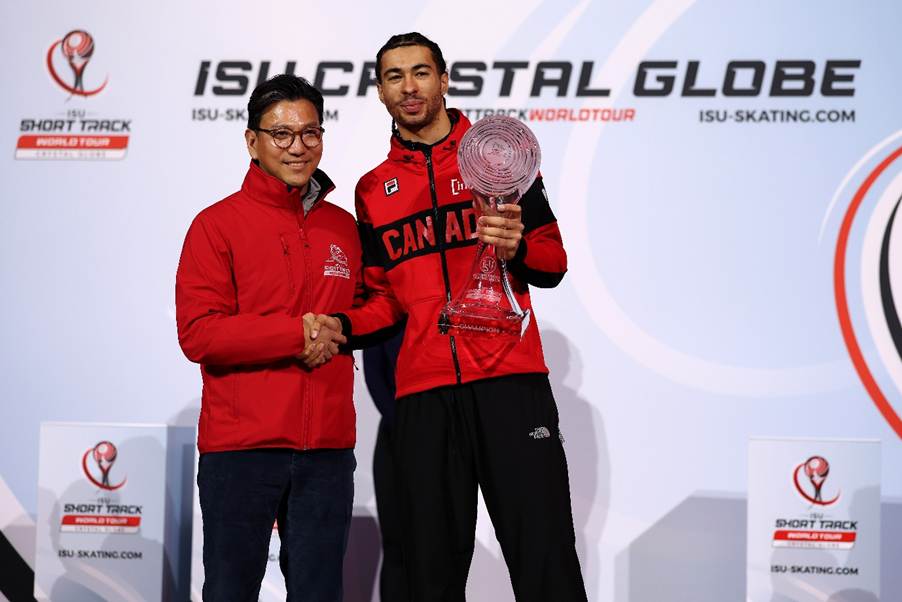 Two men holding a trophyAI-generated content may be incorrect.