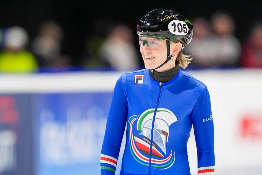 A person wearing a helmet and a blue uniformAI-generated content may be incorrect.