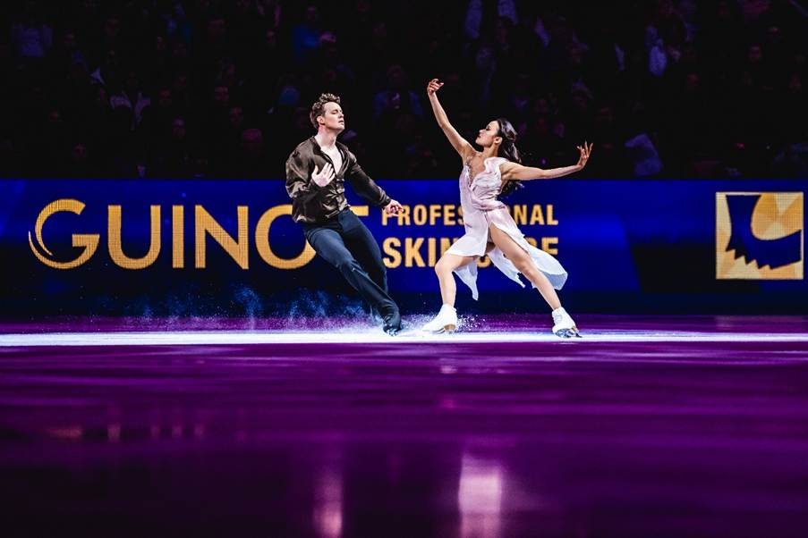 A person and person ice skatingAI-generated content may be incorrect.
