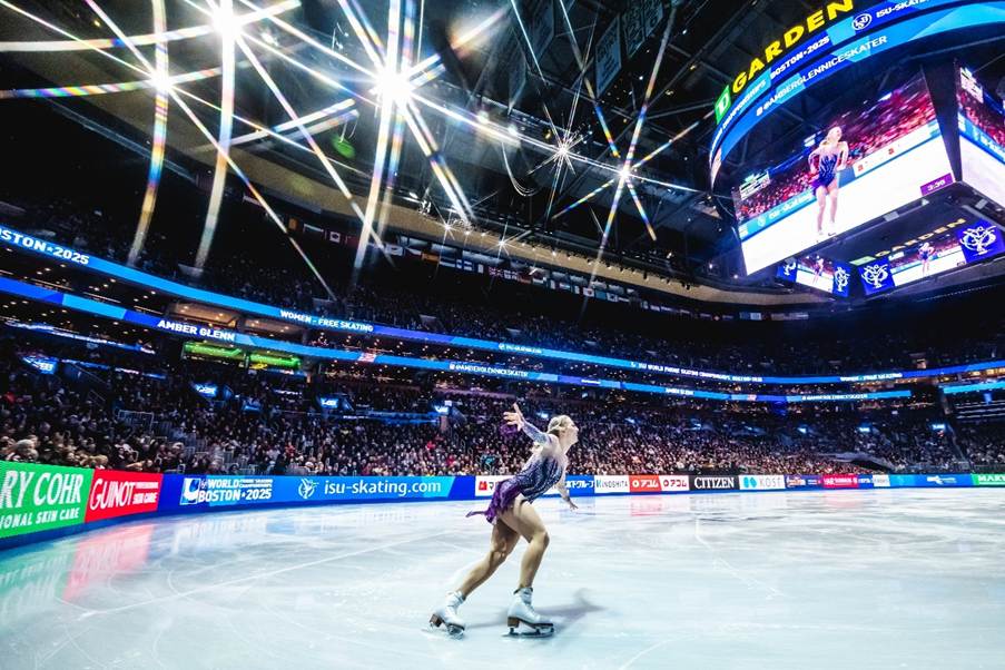 A person on ice skating in a stadiumAI-generated content may be incorrect.
