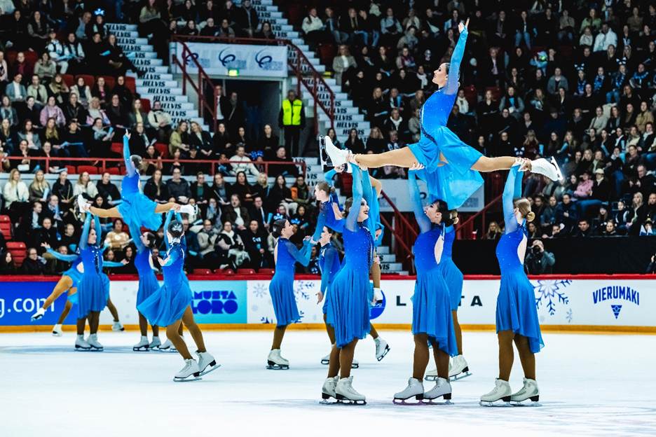 A group of people on ice skatingAI-generated content may be incorrect.