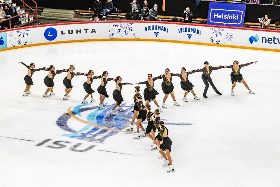 A group of people on ice skatingAI-generated content may be incorrect.